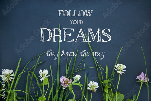motivational quote FOLLOW YOUR DREAMS on black background