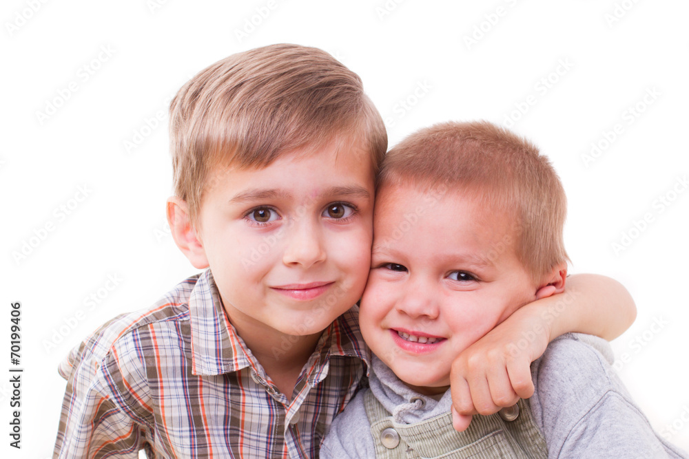 brother hugging her brother on a white background brother hugging her brother on a white background