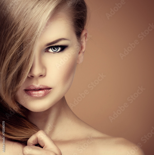 Portrait of fashion girl with professional makeup and hairstyle #70200070