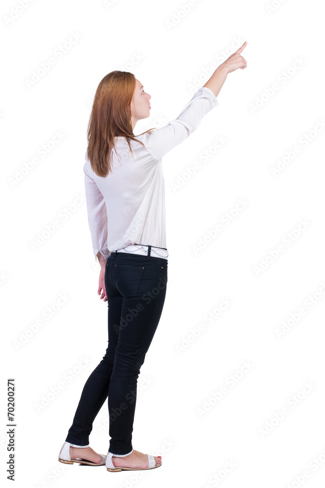 Back view of pointing woman. Back view of pointing woman.