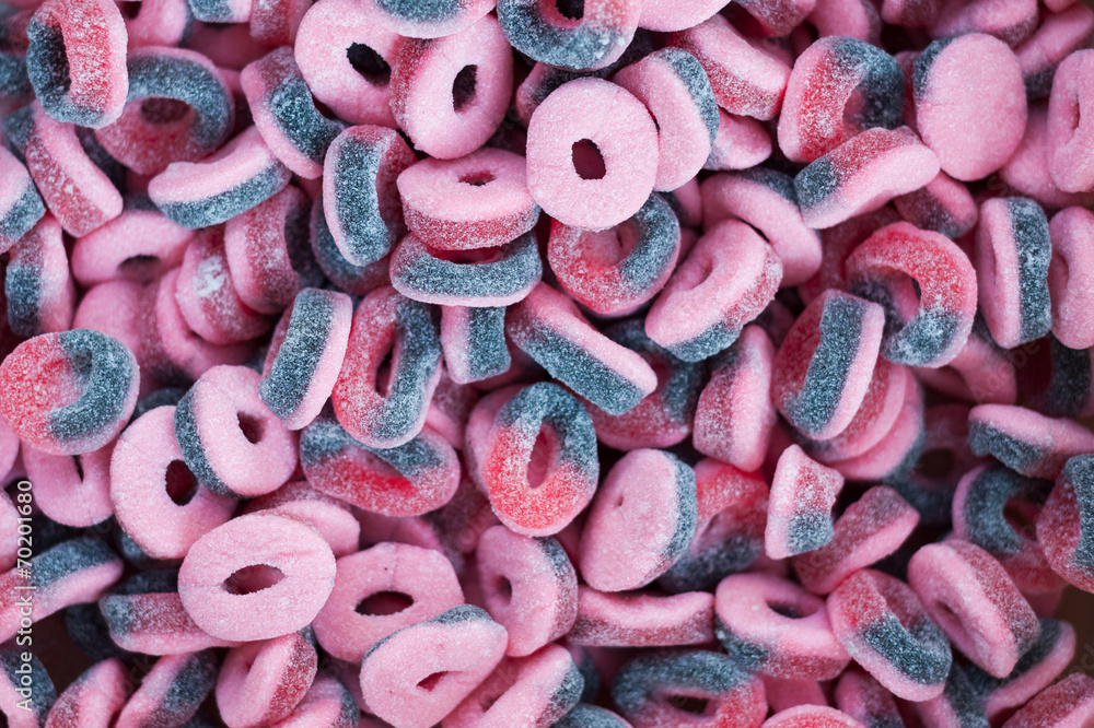 Pink purple jelly candies in the form of rings on the counter
