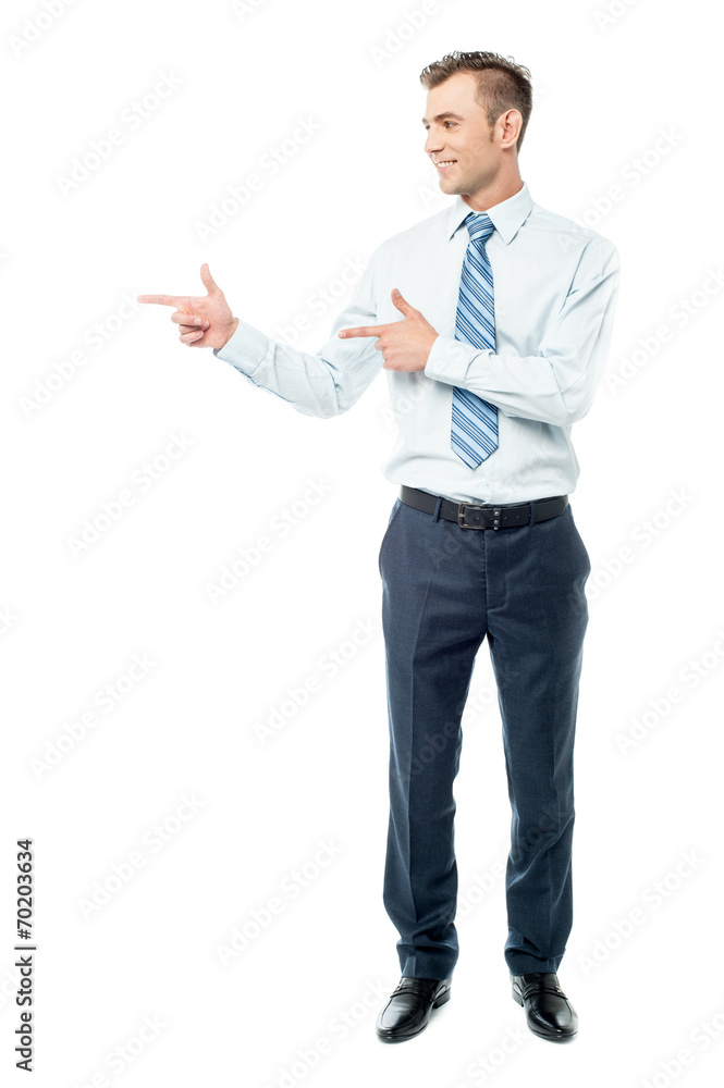 Young businessman pointing copyspace Young businessman pointing copyspace