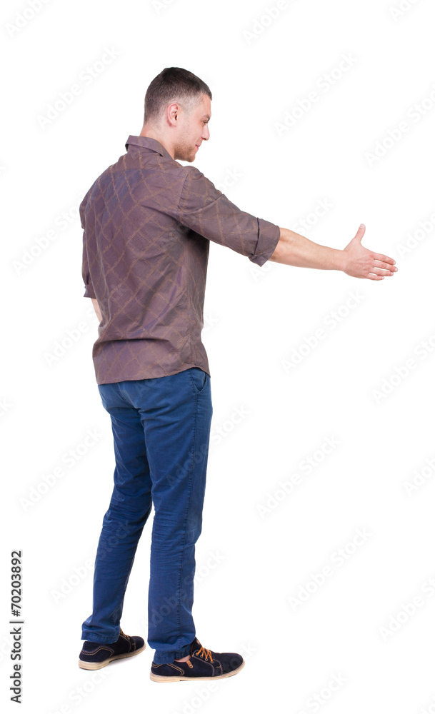 Back side view of man in shirt handshake. Back side view of man in shirt handshake.