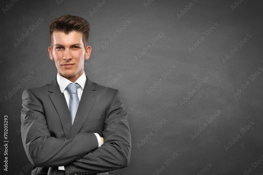Man stands in front of a wall Man stands in front of a wall