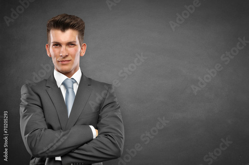 Man stands in front of a wall