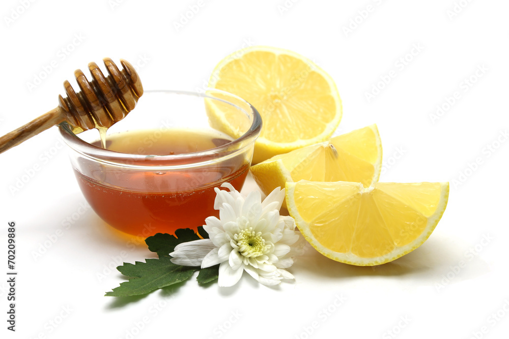 Honey and lemon on white background Honey and lemon on white background