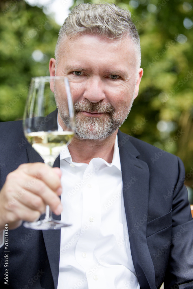 man with a glass of wine man with a glass of wine