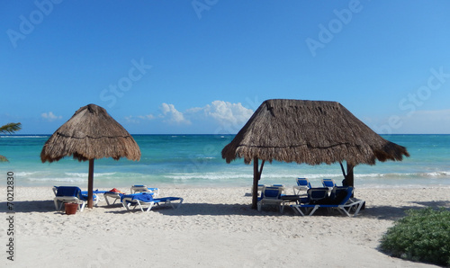 Caribbean beach with straw huts