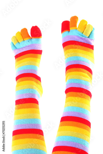 Female feet in colorful toe socks