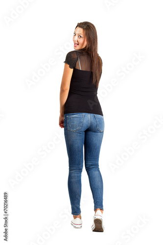Back view posing woman with turned head.