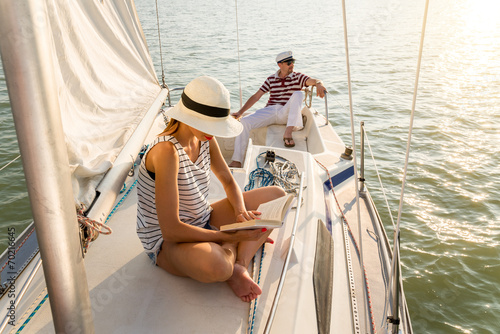 Caucasian woman reading a book at summer