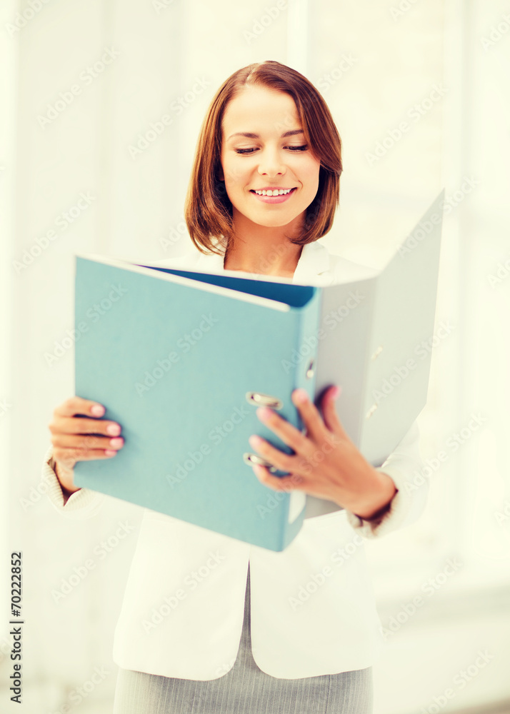 businesswoman with folders in office businesswoman with folders in office