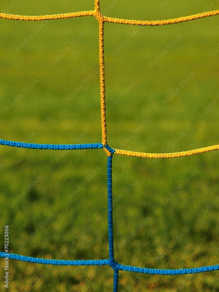 Detail of crossed blue yellow string of soccer nets. Detail of crossed blue yellow string of soccer nets.