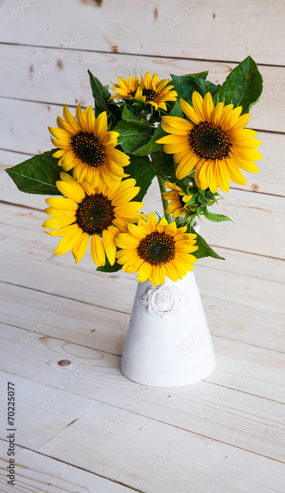 Sunflowers in a vase on a rustic, gray background Stock Photo | Adobe Stock