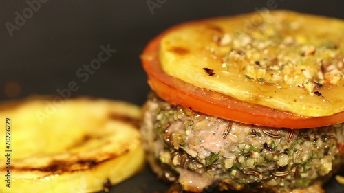 cutlet with vegetables fried in a pan photo