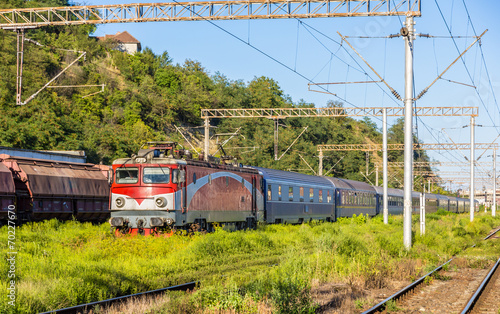 Passenger train in Sighisoara station - Romania photo