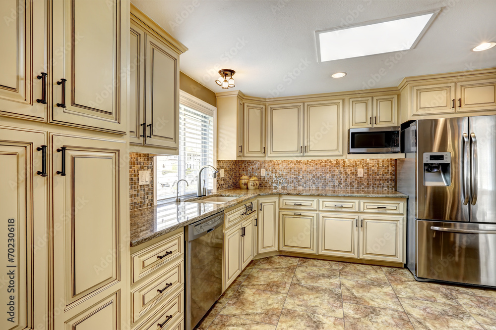 Luxury kitchen interior with back splash trim and tile floor Luxury kitchen interior with back splash trim and tile floor
