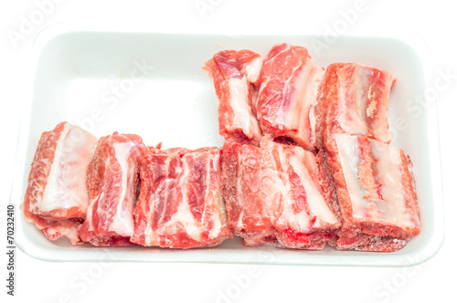 Frozen pork rib in the foam tray photo