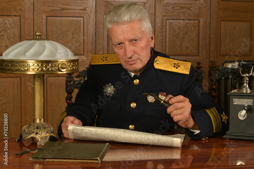 Military mature general on the table photo