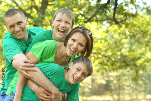 Cheerful family in green shirts © aletia2011