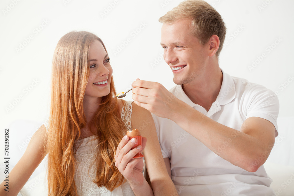 Man feeding his woman