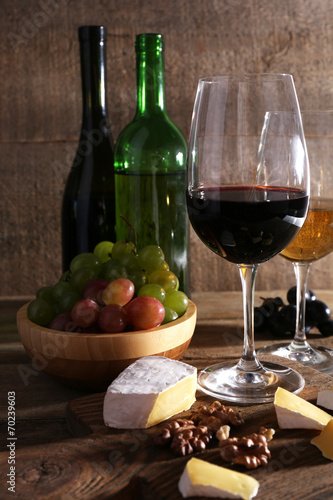 beautiful still life with wine  cheese and ripe grape