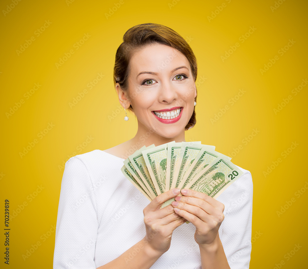 Successful young business woman holding money Successful young business woman holding money