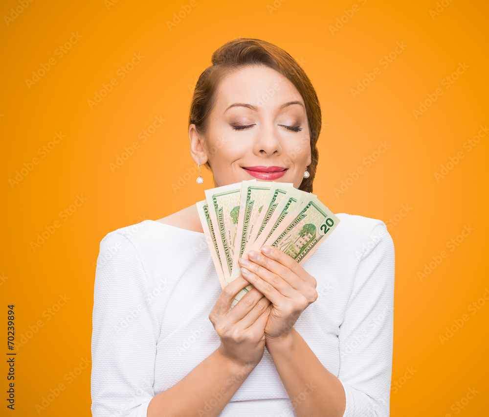 Woman loves money isolated on orange background Woman loves money isolated on orange background