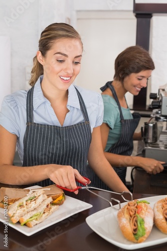 Pretty waitresses working with a smile