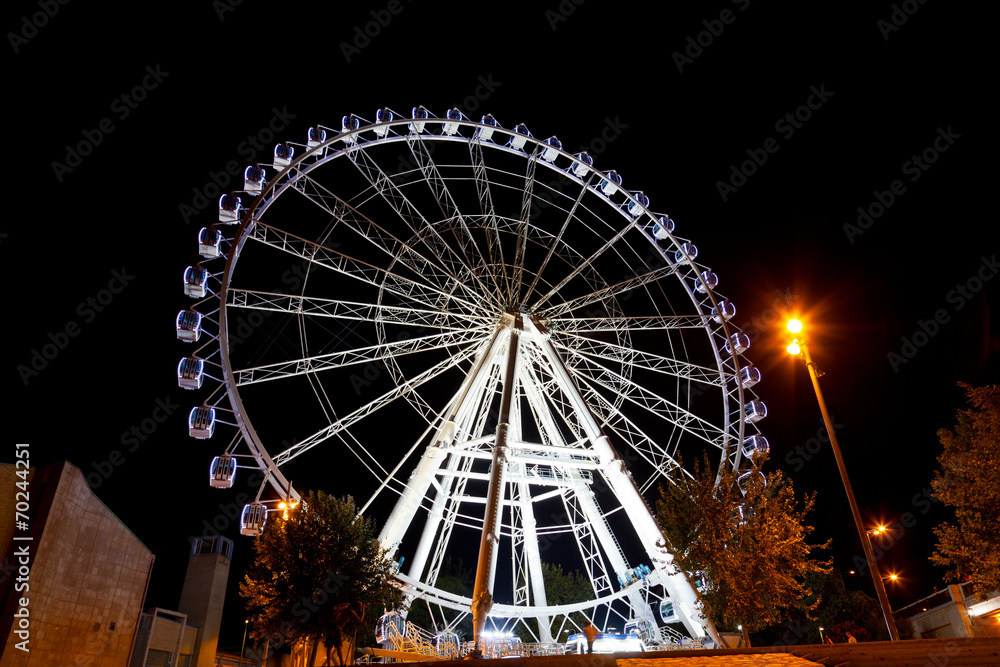 Working big wheel at night in Zaragoza, Spain