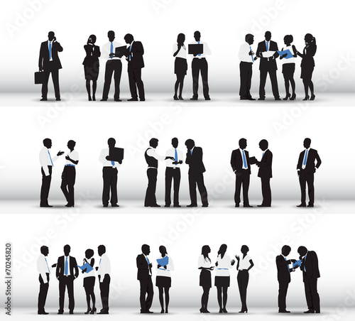 Silhouettes of Business People Working in a Row
