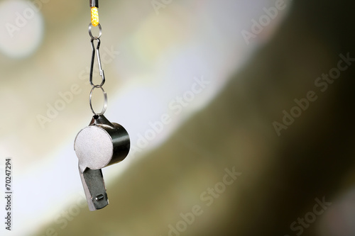 Konstfotografi Sport metal whistle on color background