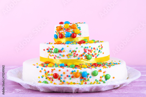 Beautiful tasty birthday cake on color background