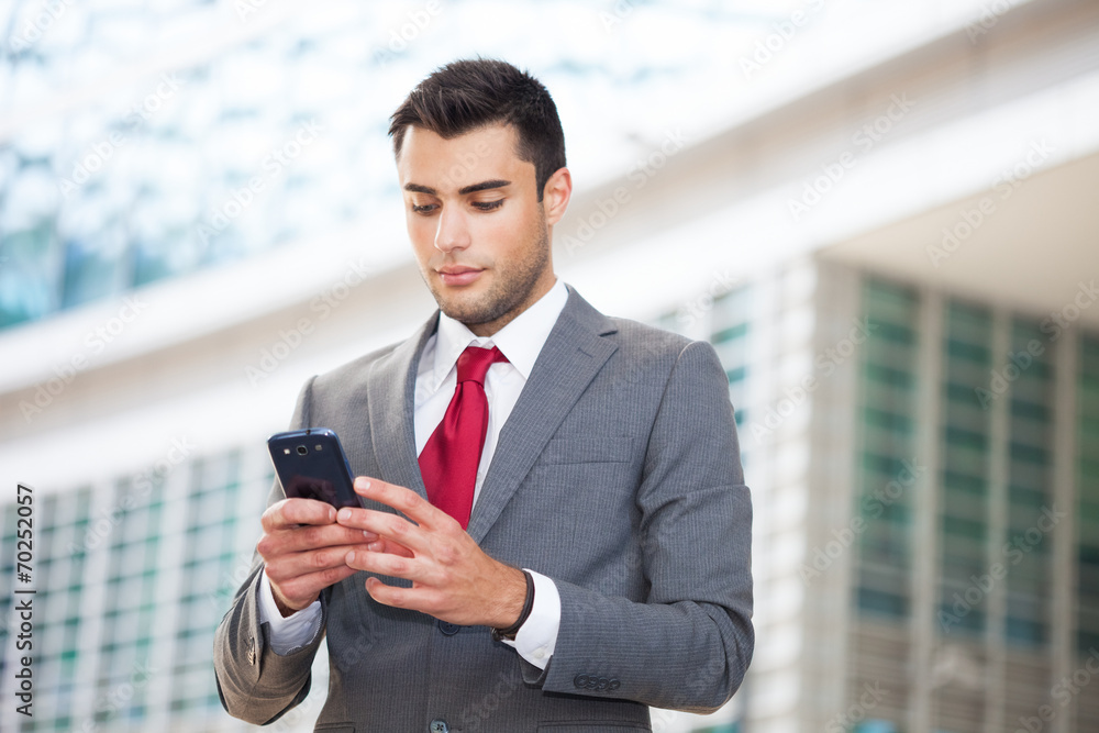 Fototapeta premium Man using his mobile phone