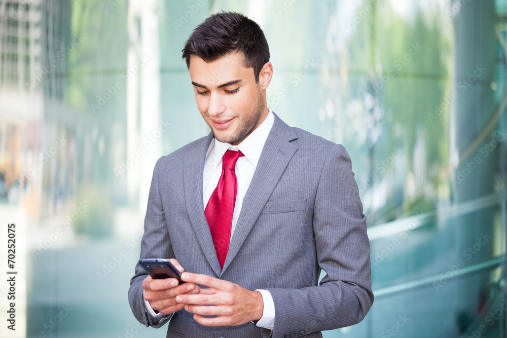 Man using his mobile phone Man using his mobile phone