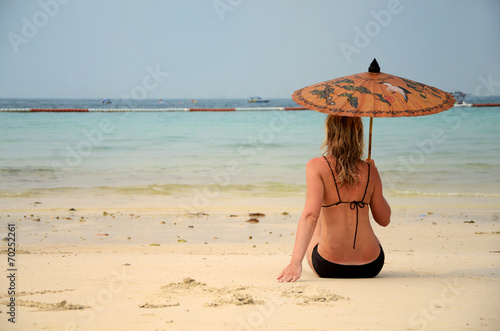 woman resting on the beach photo