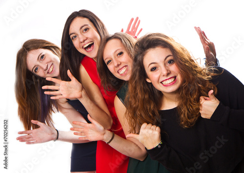  Group of girl friends isolated over a white background  photo