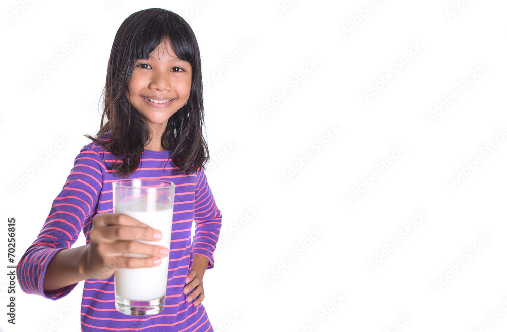 Young Asian preteen girl with a glass of milk Young Asian preteen girl with a glass of milk