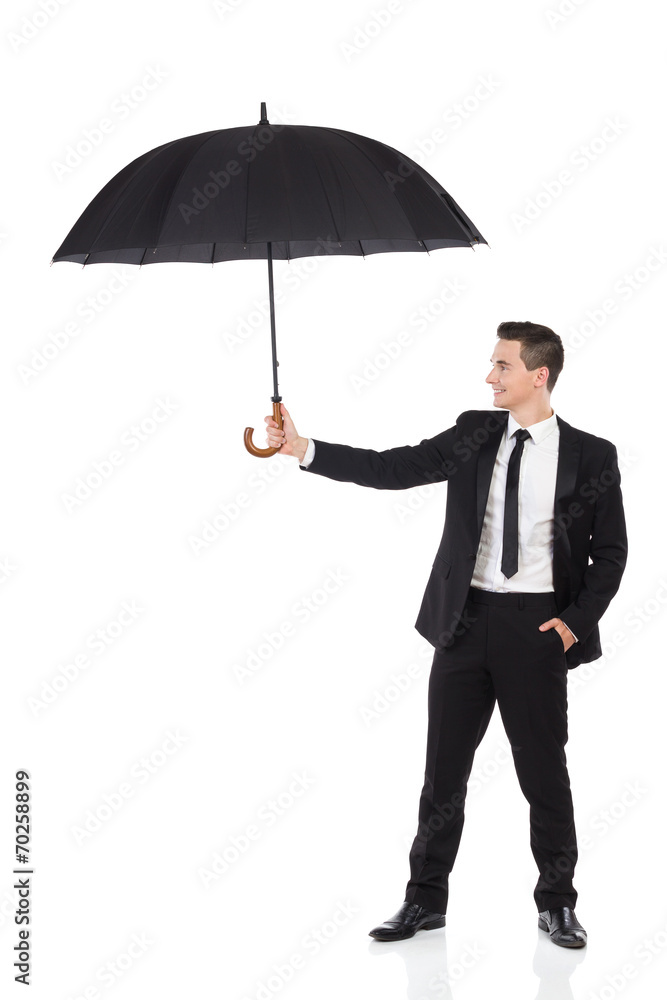 Insurance agent holding open umbrella. Insurance agent holding open umbrella.