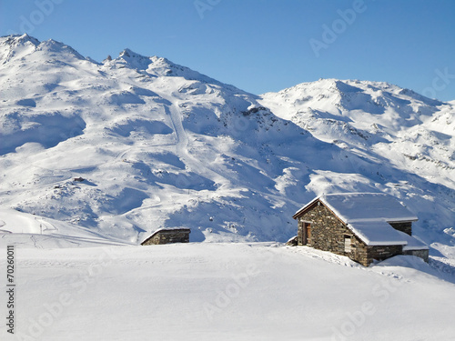 Picturesque traditional cabin in the Alps in winter #70260011