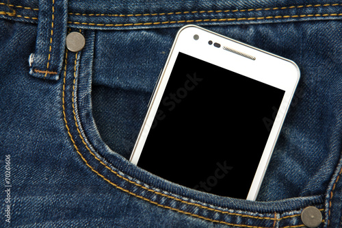 mobile phone in pocket with black screen. focus on screen.