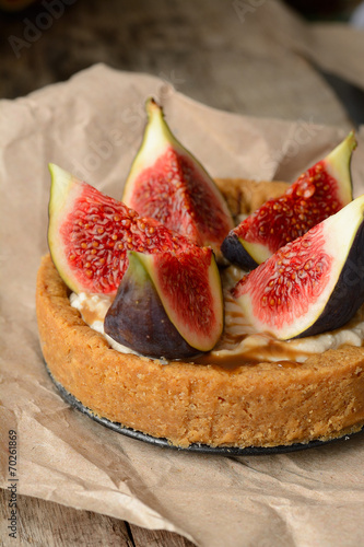 fresh tart or pie with figs, cream and mint