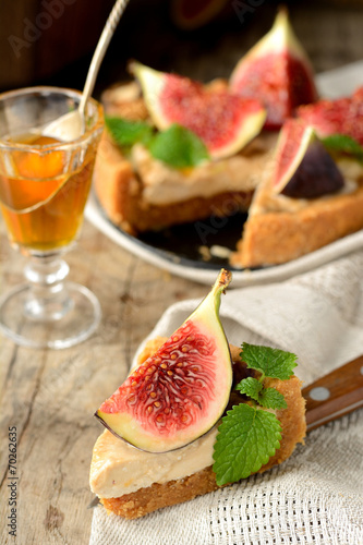 piece Tart with caramel cream and fresh figs served on a linen