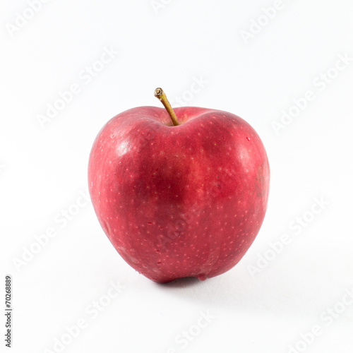 Fresh red apple on a white background