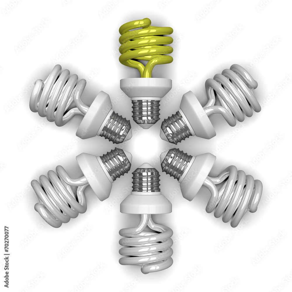 Yellow spiral light bulb and white ones lying radially Yellow spiral light bulb and white ones lying radially