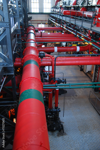Industrial building interior with pipes