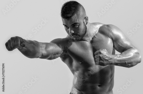 Strong bodybuilder man with perfect abs, shoulders,biceps