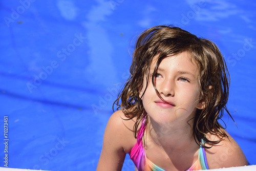 Happy kid in the swimming pool