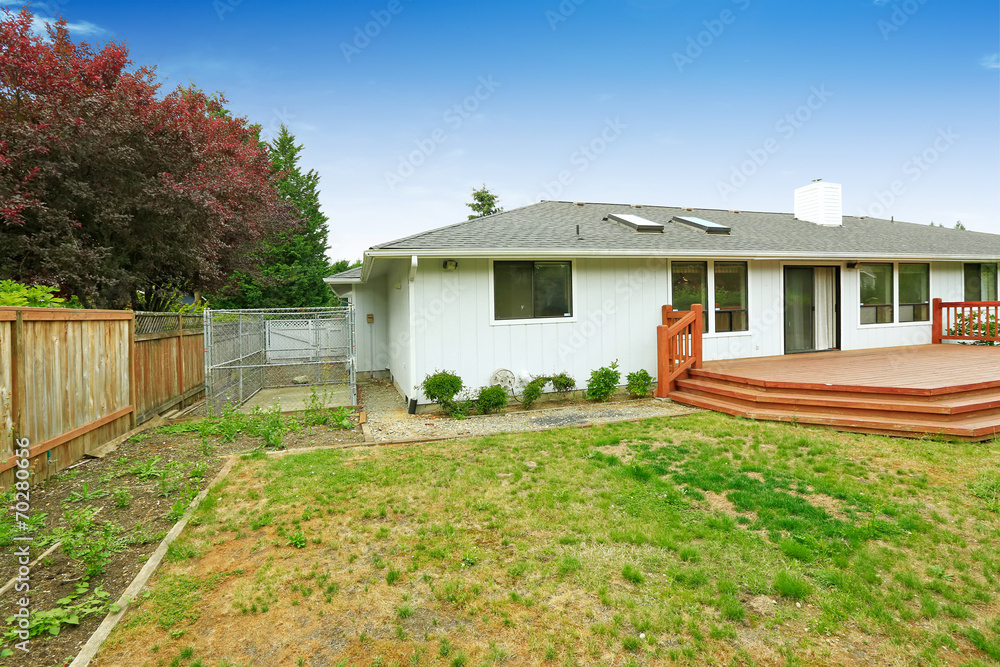 House with walkout deck. Backyard view House with walkout deck. Backyard view