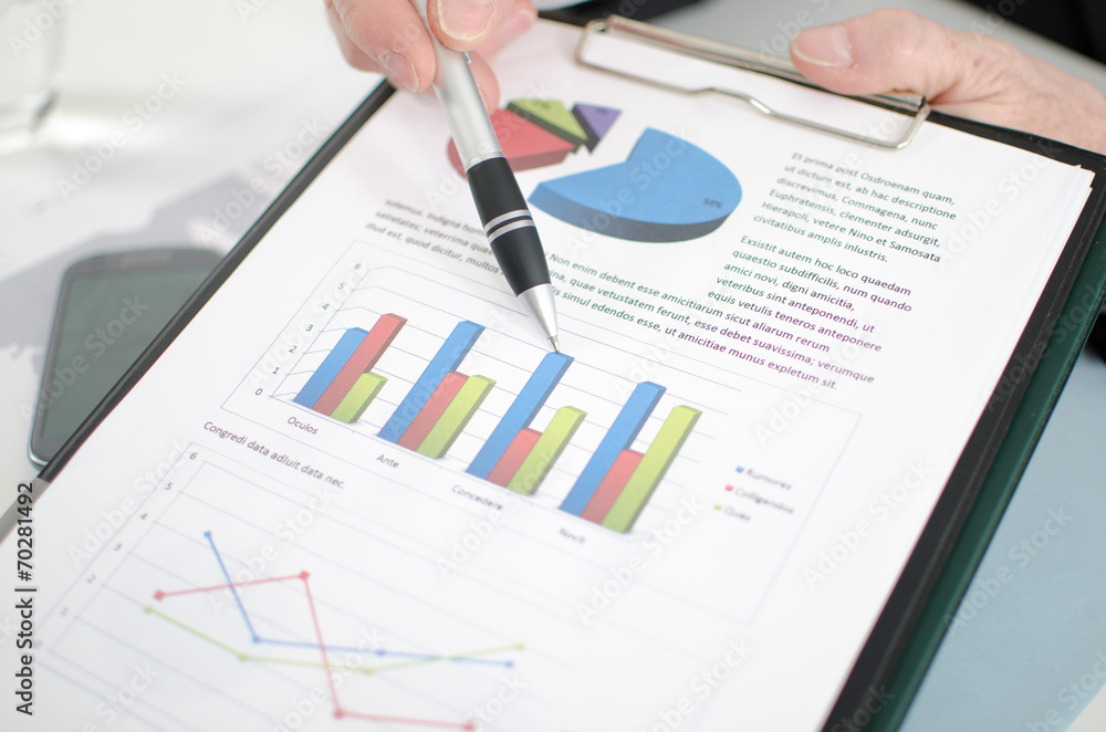 Businessman showing graphs Businessman showing graphs